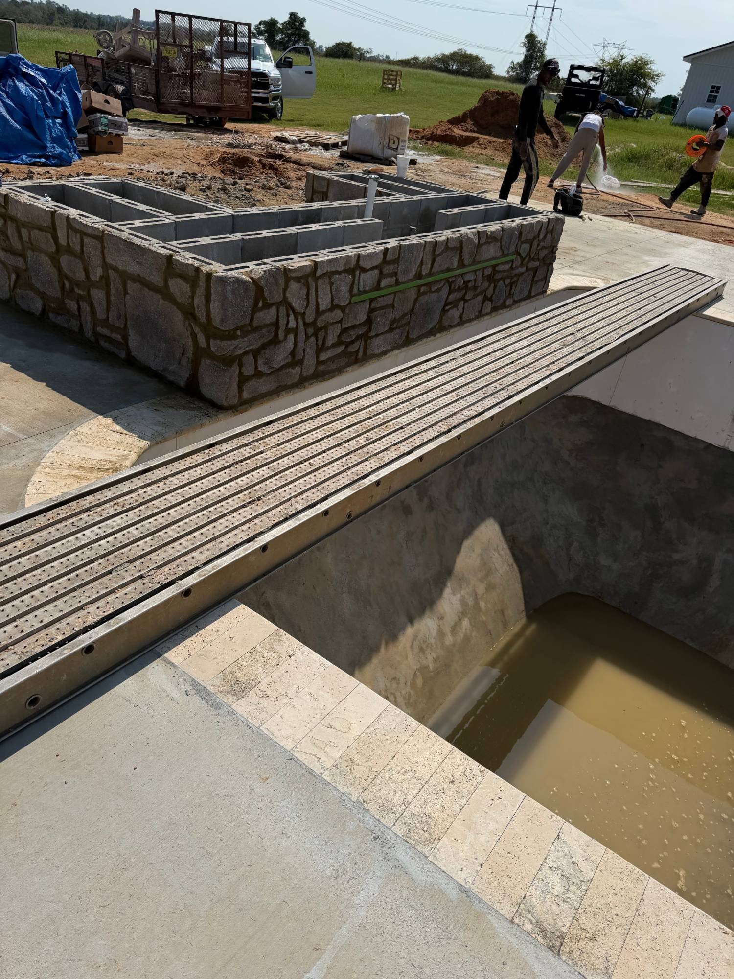 Nature Works crew building a pool structure on site